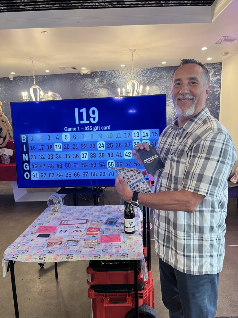 Bingo Night winner posing with his prize