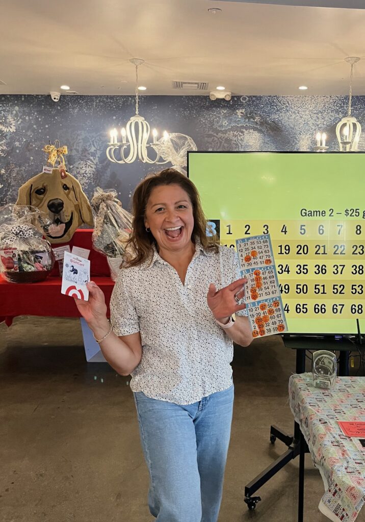 Bingo Night winner celebrating with her prize