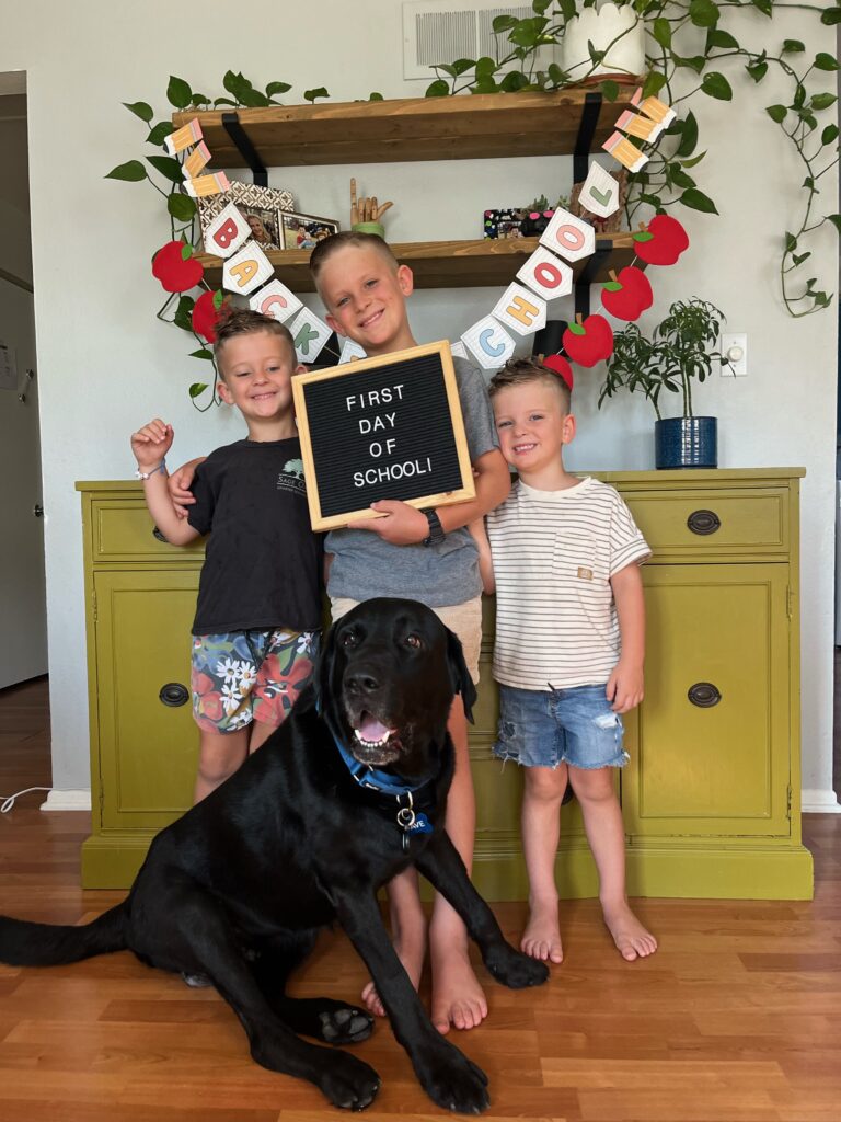 Blaze with the three boys in his new adoptive family on their first day of school