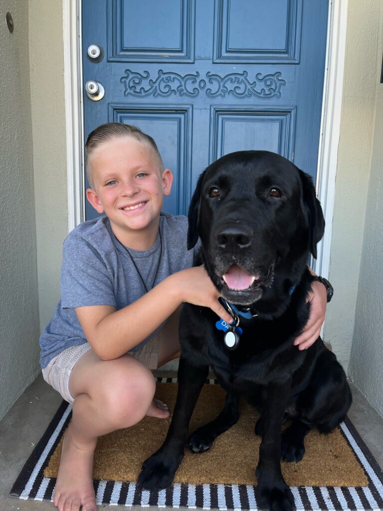 Blaze sitting with one of his new brothers at his forever home